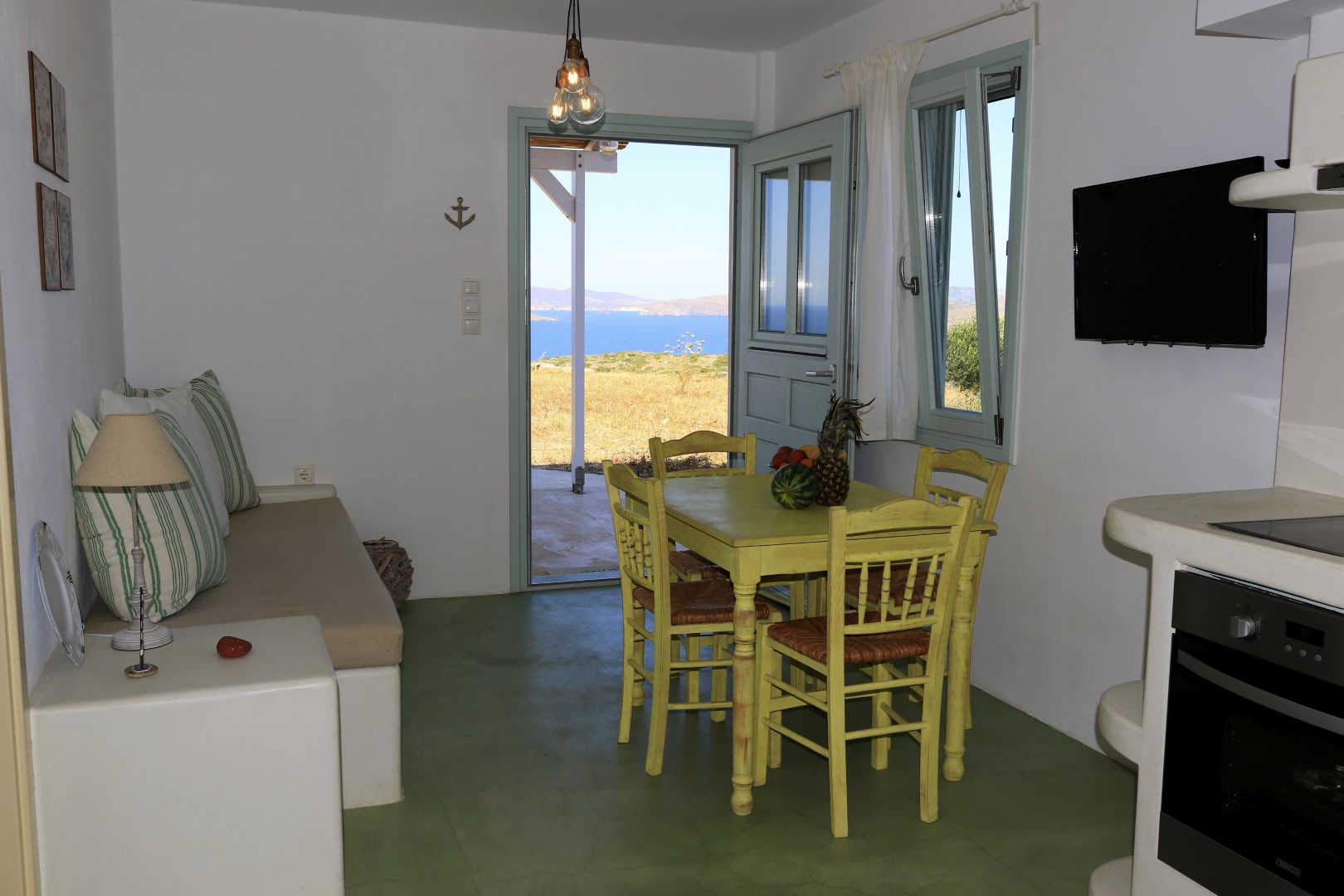 The Cedar · The living room opens straight onto the sea