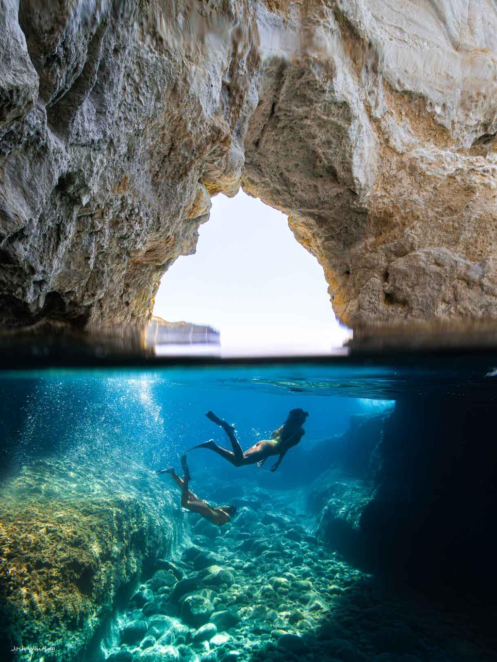 Snorkelling in the clear sea caves of Milos